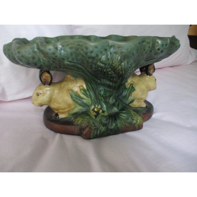 This is a Fabulous! Vintage Majolica Pedestal Centerpiece Bowl that has a base with two Brown Rabbits Hiding Under a...