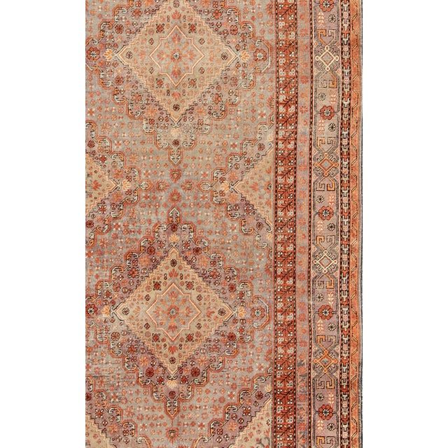 Measures: 6'6 x 13'. Antique Khotan Rug with Medallion Design in Muted Blue, Rust, and Soft Beige 6'6"x13'0". Keivan Woven...