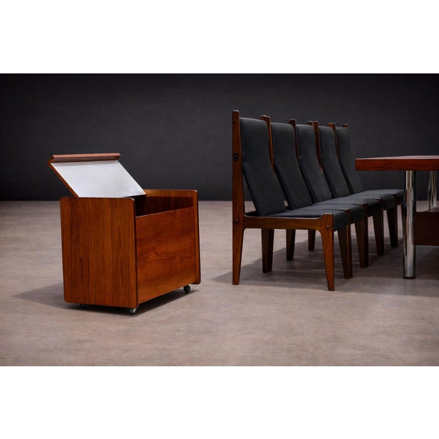 Crafted in solid jacarandá (Brazilian rosewood), this bar cart reflects the measured functionality and material refinement...