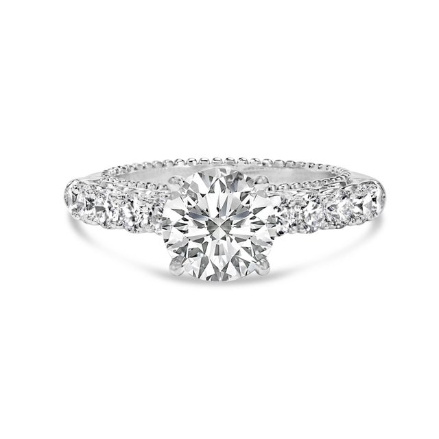 Immerse yourself in the timeless elegance of this 14K white gold engagement ring, where modern craftsmanship meets vintage...