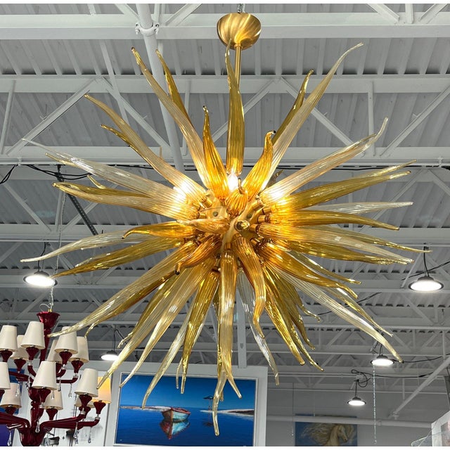 Price reduced $3,000. Now only $4,900! This incredible Sol chandelier was created by well-known Glass Master Simone...