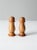 This is a pair of vintage wooden salt and pepper shakers circa mid 20th century. The wood shakers have a rounded design...