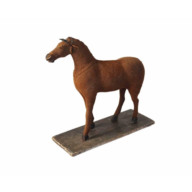 Antique Americana, folk art horse figure on wooden base. Mohair coat with straw fill, wooden feet and muzzle with glass...