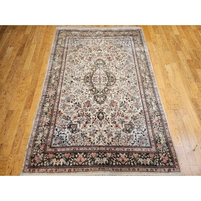 This refined vintage Indian silk rug showcases the elegance and precision of late 20th century hand-knotting traditions at...