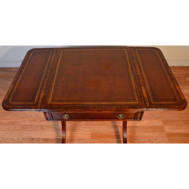 We are pleased to offer this beautiful Regency Drop-leaf table , by Heritage Henredon from the 1920. This Table is made of...