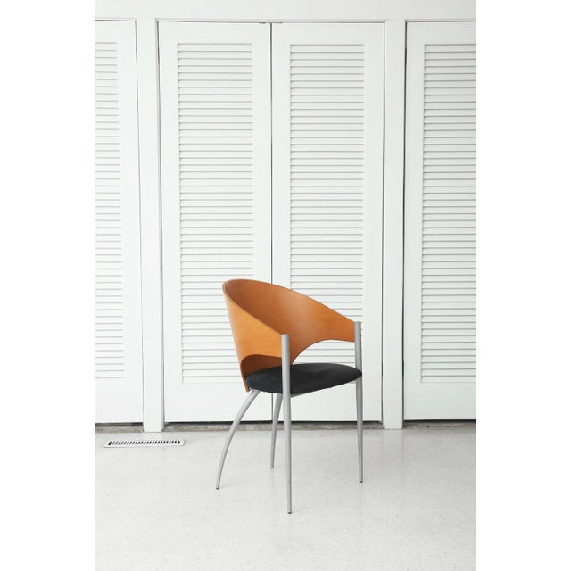 Sculptural Italian design by Cattelan Italia, marked on underside. Features a curved wood backrest, matte silver metal...