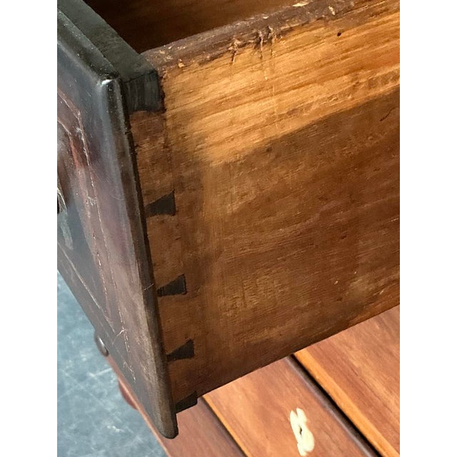 This imposing chest of drawers, likely a revival piece from the mid-20th century, captures the stately elegance and solid...