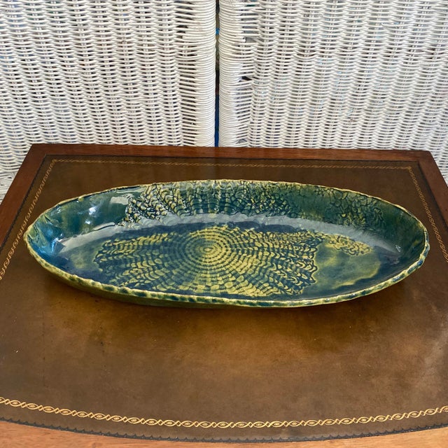 Stunning oblong serving platter. This blue and green folk art pottery serving dish will add gorgeous detail to your home....