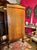 Elegant 19th century biedermeier fruitwood armoire with dolphin carvings, gilt details, and urn shape. A rare italian...