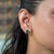 A matched pair of Zambian emerald cabochons glows in deep, saturated green in these solid 14K yellow gold solitaire stud...
