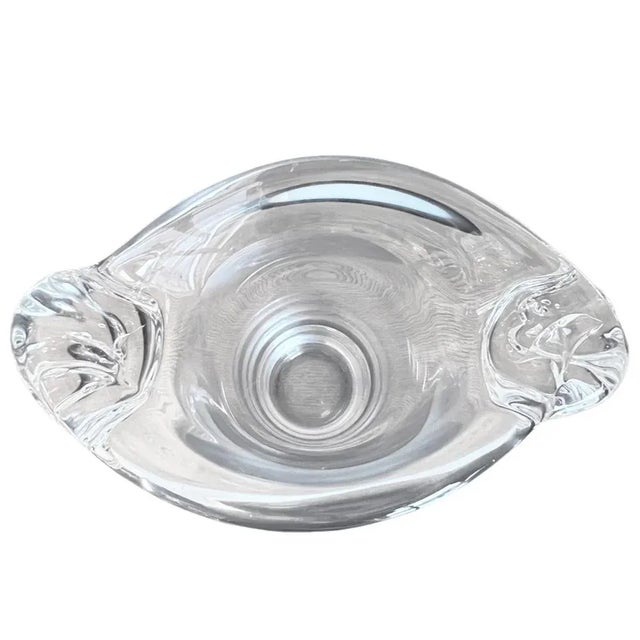 This large clear glass vase has been crafted with a beautiful swirl design on either side. Made by the maker Daum in the...