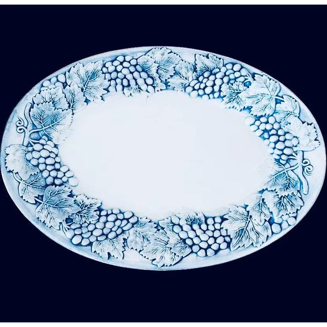A large oval Majolica platter a beautiful blue grapevine & white finish, made in Portugal perfect for any occasion.