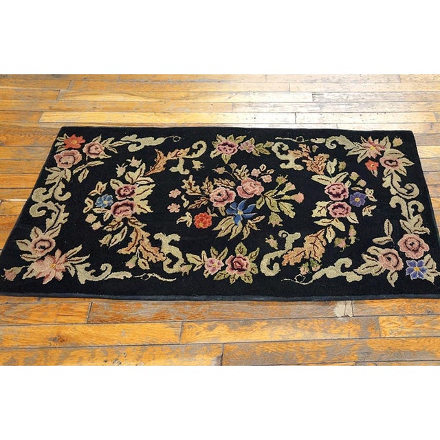 Antique American Hooked rug, size: 2'4" x 4'2". American Hooked Rugs Contemporary American Hooked carpet utilizing strips...
