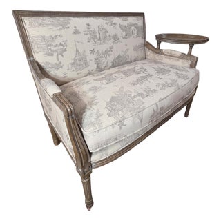 French Louis XVI Style Toile Upholstered Settee With Distressed Carved Wood Frame For Sale