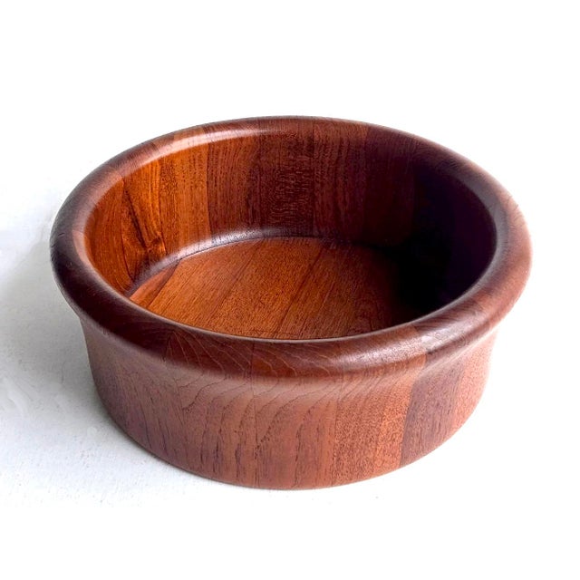 Offered is a lovely Danish Teak wood bowl made by Kalmar Designs in the 1960s. It features a fabulous rolled rim and deep...
