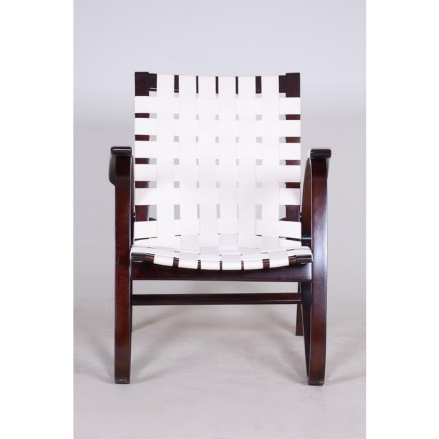 This iconic armchair, designed by the prominent Czechoslovak designer Jan Vaněk during the 1930s, represents an...