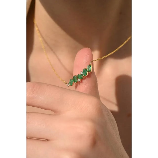 Emerald Bar Pendant Necklace with Diamonds in 14K Gold studded with octagon cut emerald and round cut diamonds. This...