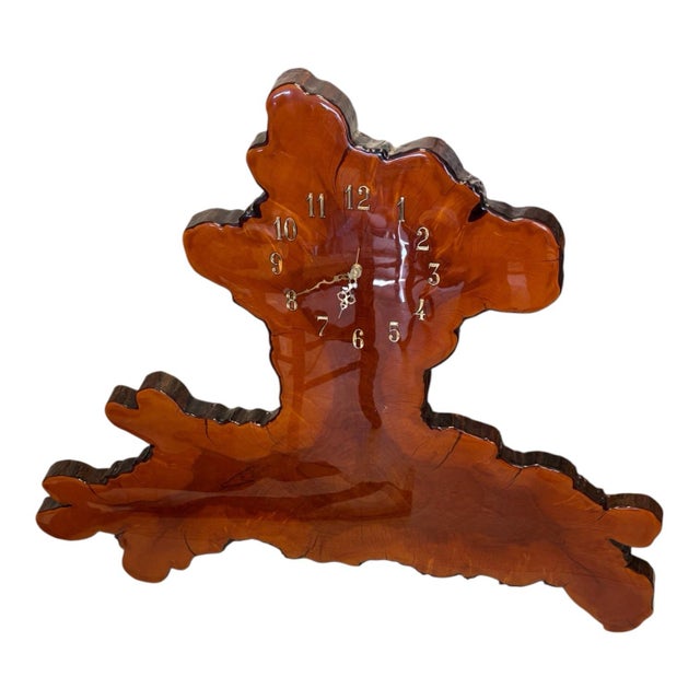 A dramatic vintage sculptural wall clock crafted from a substantial natural wood slab with an extraordinary free-form...