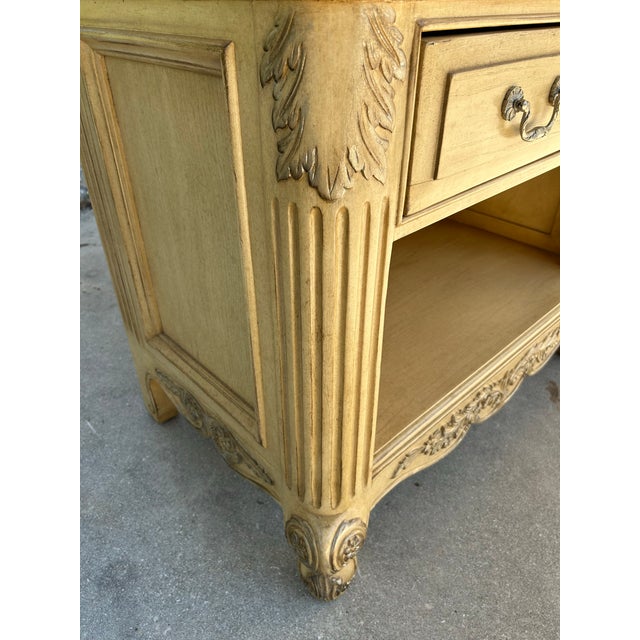 Understated elegance exemplifies the quality of this Marge Carson created oak nightstand produced in a classically French...