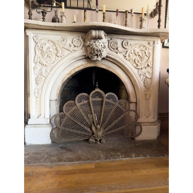 Antique brass peacock folding fireplace screen, late 19th to early 20th century. Pierced brass panels form a radiating...