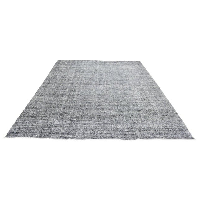Hand-knotted with care using traditional rug-making techniques, this wool rug blends timeless craftsmanship with a modern...