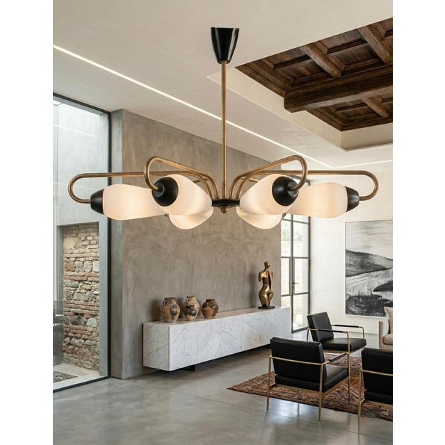Designed in France in the early 1950s, this chandelier captures a moment when lighting was conceived as both utility and...