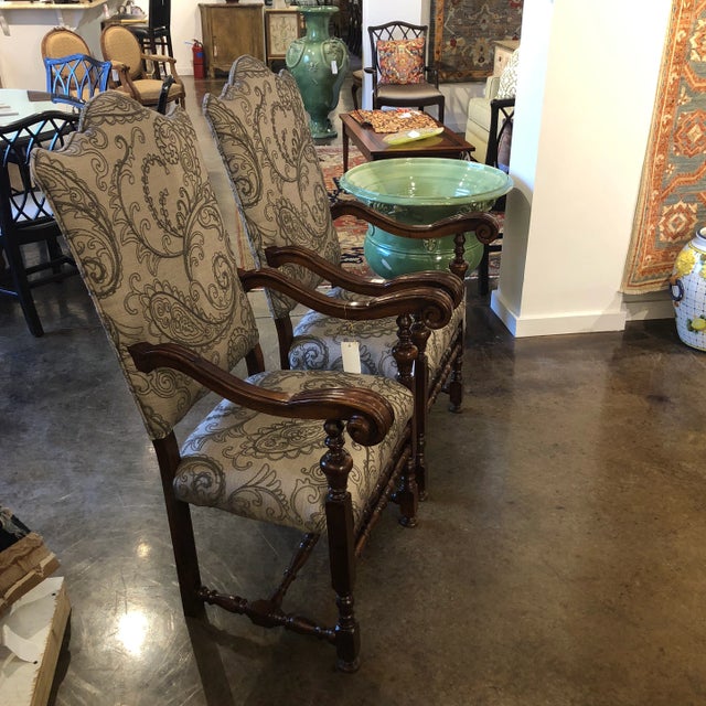Pair of walnut carved Louis XIII style arm chair with shaped back in an embroidered upholstery. NEW-SHOWROOM Sample - Italy.