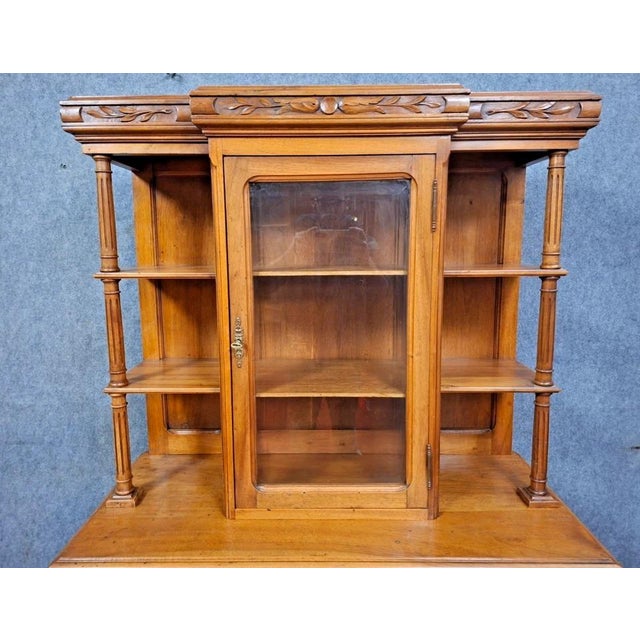 Beautiful antique two-piece walnut sideboard, full of charm and character. Made of solid wood, this piece features lovely...