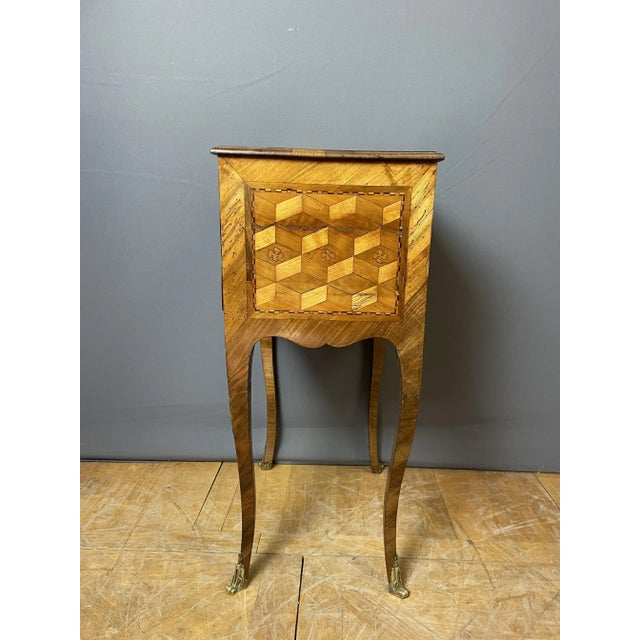 Transition period Louis XV Louis XVI side table or chiffonnière circa 1760. It opens with five drawers on the front and...