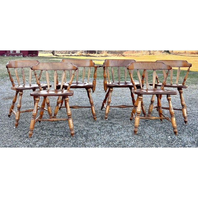 Great set of exceptional arrowback windsor captains chairs by Cushman Colonial Classics for J B Van Sciver Co. expertly...