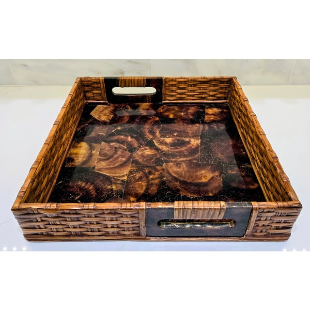 Elevate your coffee table or bar with this richly textured Palecek inlaid penshell square tray. The design features a warm...