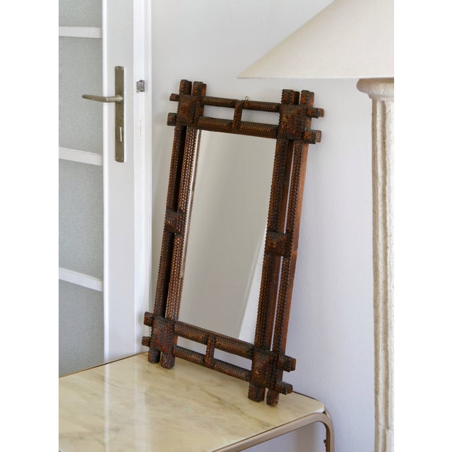 Beautiful tramp art mirror with pyramid shaped details. In great condition, fully hand made.