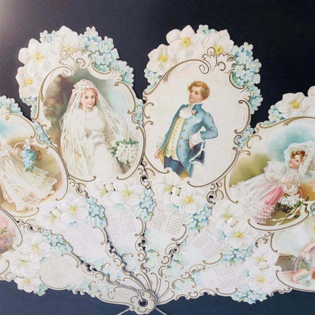 This is a gorgeous framed antique calendar fan from the year 1900. It features a series of beautiful illustrations of a...