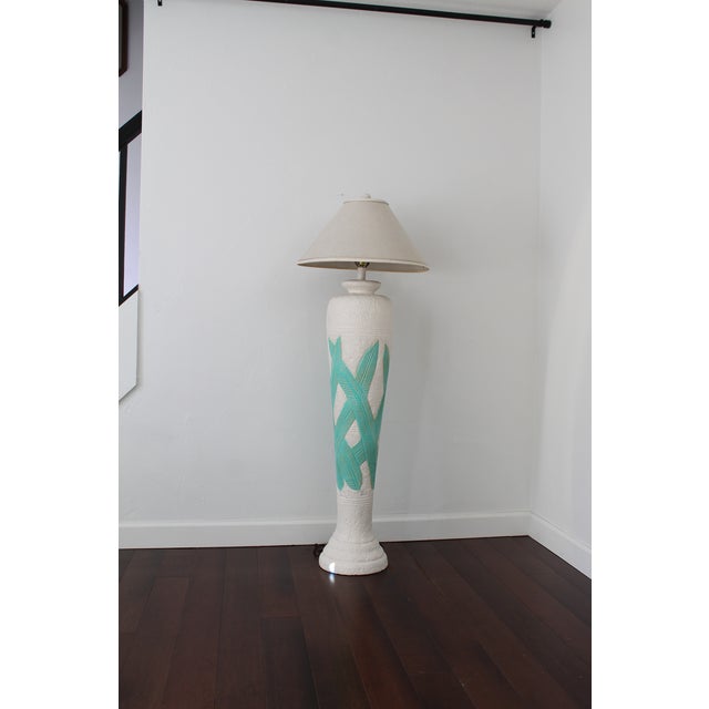 Awesomely 80's tropical plaster floor lamp. Bright white textured lamp features carved green palm leaves, a beautiful pop...