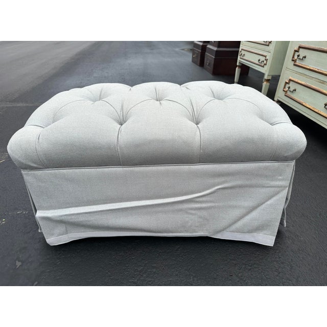 Custom Tufted Ottoman in light gray, traditional style with skirt. 20" x 42" x 20"H. Recently reupholstered, barely used,...