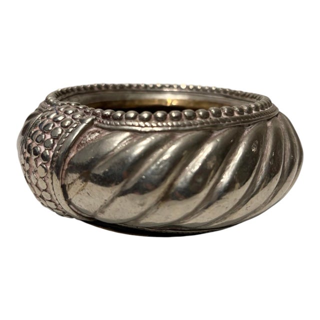 A truly unique early 19th-century African bracelet thoughtfully repurposed into a decorative dish. Silver-plated with...