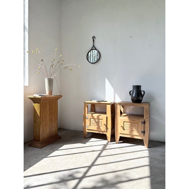 Antique vase with handles and a deep black glaze, signed by the Accolay potters. Its understated design reflects the...