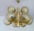 very large mid century pendant light, brass structure with 9 radiating beams and large amber tint structured glass globe...