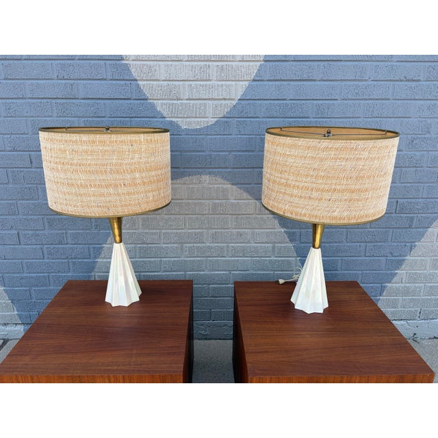 Pair of Sculptural Mid-Century Modern Table Lamps with Pleated White Bases and Brass Accents A striking pair of Mid-...