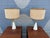 Pair of Sculptural Mid-Century Modern Table Lamps with Pleated White Bases and Brass Accents A striking pair of Mid-...