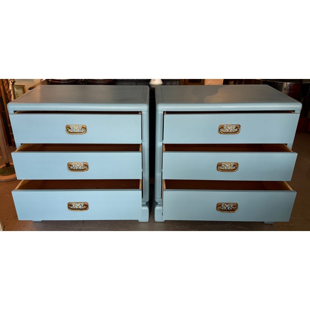 These vintage Bernhardt Furniture nightstands showcase a classic Chinoiserie or Hollywood Regency style with a distinctive...