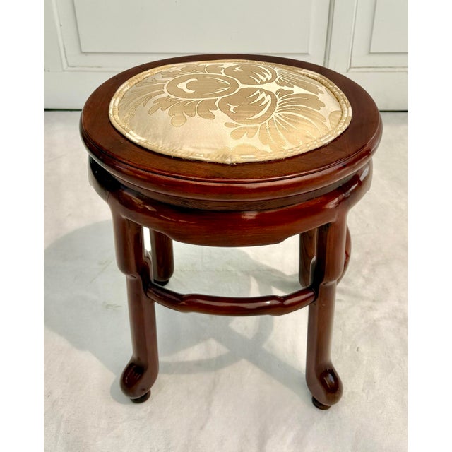 Here is a beautiful elmwood stool made in Jiangsu, China in the 19th century. The piece has an oval shape with lovely,...