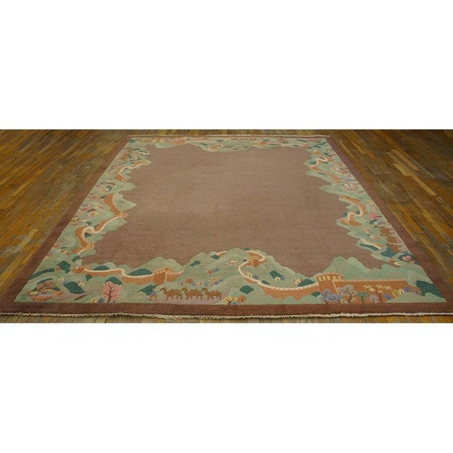 Antique Wool Brown Earth Tone Hand Knotted Pile Rug, Circa Date: 1920s. This exceptional piece captures the imaginative...