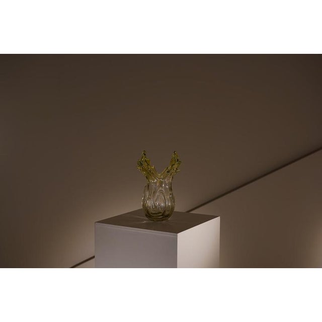 Vase made of Murano glass, with a translucent olive green finish that adds depth and subtle nuances to the piece. Its...