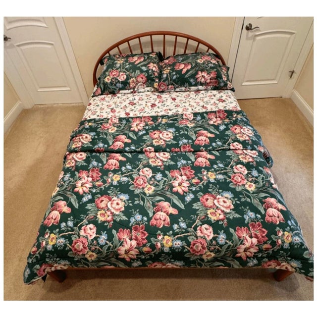 Queen bed frame with a spindle headboard and footboard in good condition. Dimensions are 84 inches long, 62 inches wide,...