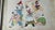 The Antique Oil Painting is on silk. It shows several Chinese children playing with masks, a sword, a flag. The painting...