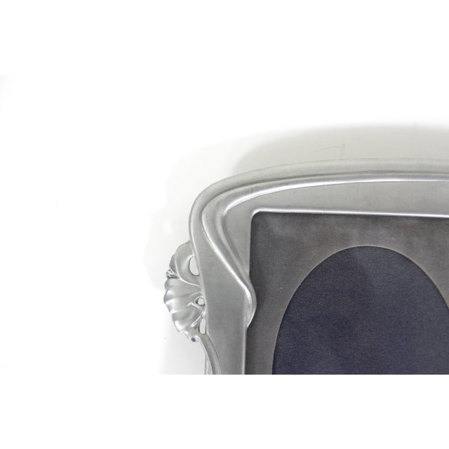 Vintage Art Nouveau style pewter rectangular frame made by Seagull Pewter Canada. This has a removable velvet matte to...