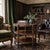 A very elegant 3-tier round center table hand-made in a luxurious brown leather finish and dark wood construction...