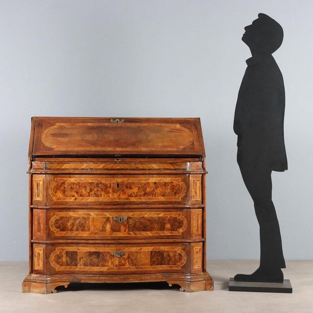 Baroque walnut and crotchet chest of drawers with maple and olive wood trim. Three-drawer curved front, drop-leaf upper...