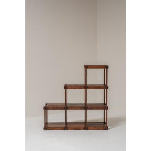 Beautiful modular shelving system from France, dating from the 1970s. Crafted from richly toned wood with striking visible...
